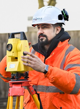 Triangle team member surveying